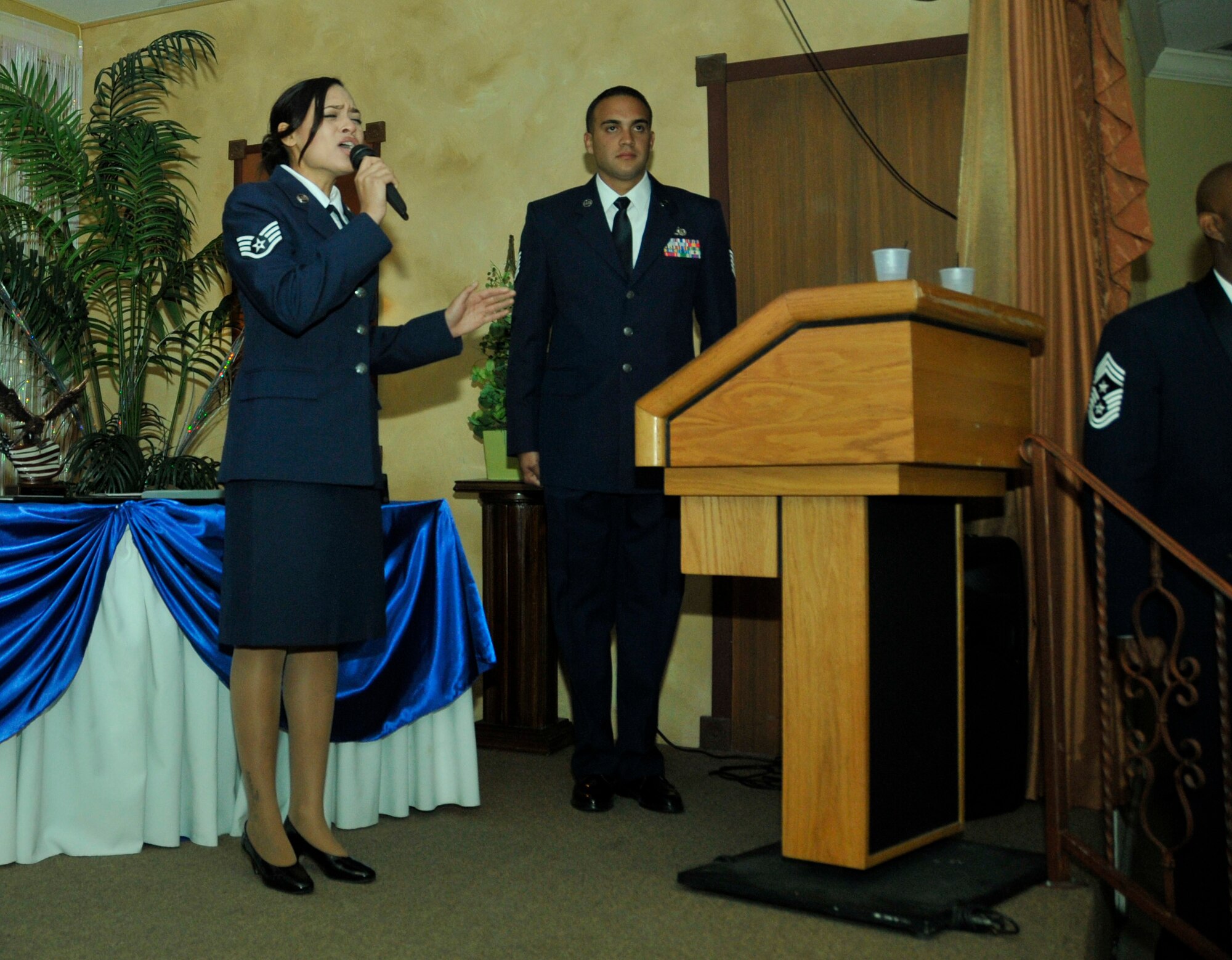 Staff Sgt. Christy Leyva sings the National Anthem during Sharkfest 2013 at the Royal Palace Banquet Hall in Homestead, Fla., March 2. Members of Homestead Air Reserve Base’s 482nd Fighter Wing, 482nd Maintenance Group, and Det 2, 20th Operations Group  gathered for the event which is an awards banquet where maintenance personnel from the base were recognized and honored for exceptional and outstanding performance throughout the previous year. (U.S. Air Force photo/Senior Airman Nicholas Caceres)