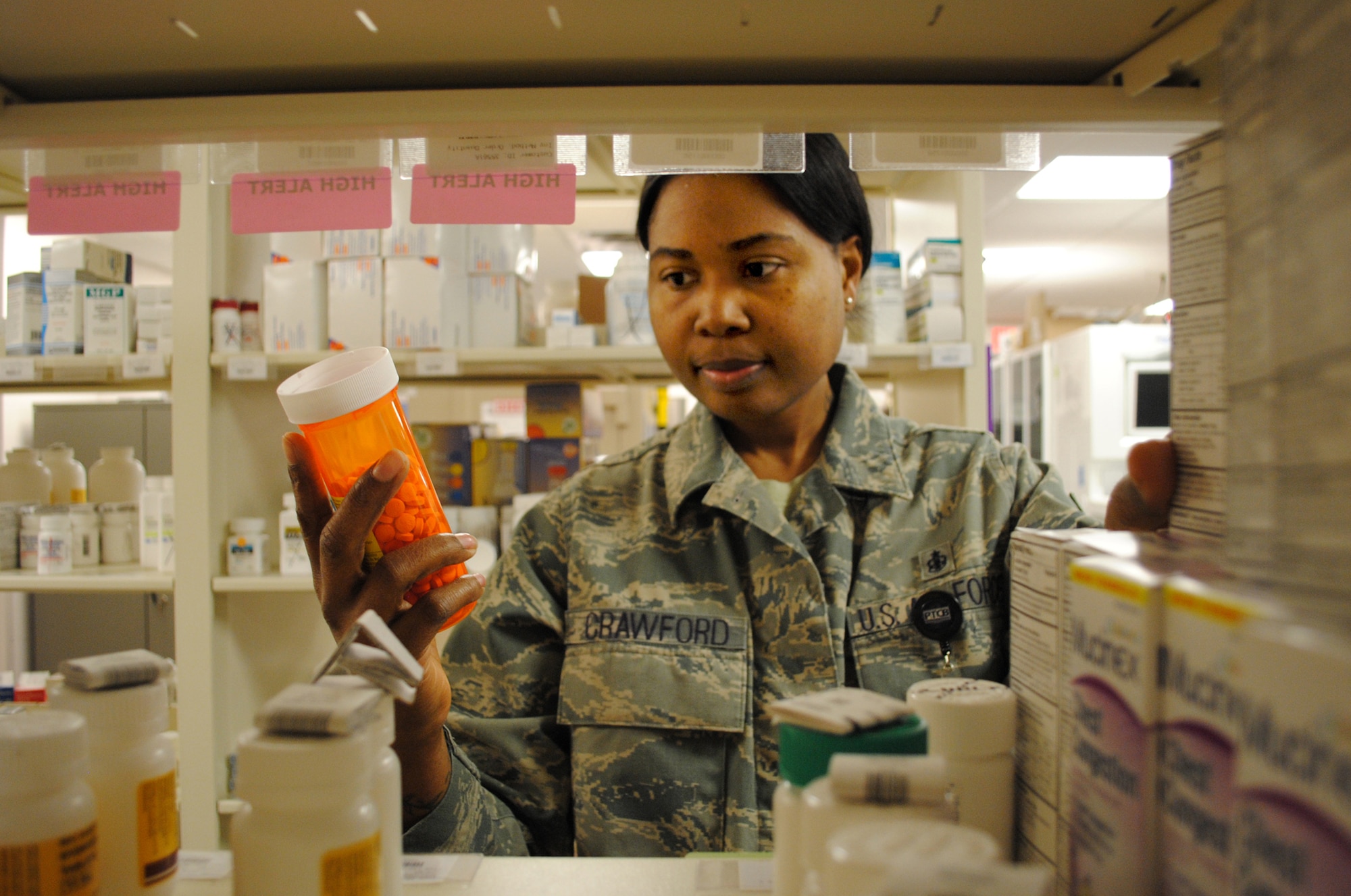 Tech. Sgt. Markiesha Crawford, 319th Medical Support Squadron NCO in charge of the pharmacy flight, checks the label on a prescription bottle March 4, 2013, at the medical clinic on Grand Forks Air Force Base, N.D.  Crawford is Grand Forks AFB’s Warrior of the Week for the first week of March 2013. (U.S. Air Force photo/ Staff Sgt. Luis Loza Gutierrez)