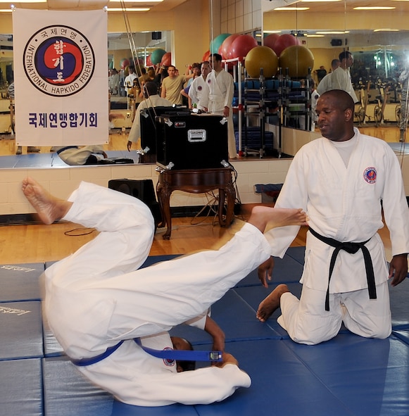 Lt. Col. John Lofton, Air Force Global Strike Command, watches as one of his students performs a roll maneuver during a Hapkido class at the Fitness Center on Barksdale Air Force Base, La., March 1. Lofton has studied martial arts for more than 25 years and introduced the Korean Hapkido class to Barksdale shortly after arriving on station. (U.S. Air Force photo/Staff Sgt. Amber Ashcraft)