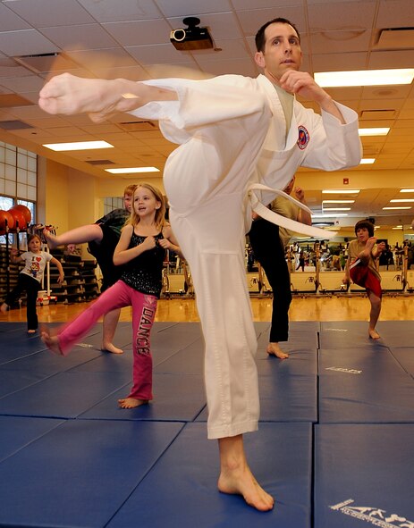 Maj. Craig Sheumaker, 8th Air Force, TF 204, performs a move during a Hapkido class at the Fitness Center on Barksdale Air Force Base, La, March 1. The class, taught by Lt. Col. John Lofton, Air Force Global Strike Command, is a soft form of Korean martial arts focusing on the ability to defend yourself without causing permanent physical damage to an attacker. (U.S. Air Force photo/Staff Sgt. Amber Ashcraft)