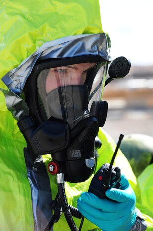 Senior Airman Nicholas Johnson, 99th Medical Group, bioenvironmental engineer journeymen, relays information about a chemical spill to his command during a simulated hazardous material incident Feb. 28, 2013 at Nellis Air Force Base, Nev. Johnson and other emergency responders report data as they discover it to ensure accurate information is passed to the incident commander. (U.S. Air Force photo by Staff Sgt. William P. Coleman)  

