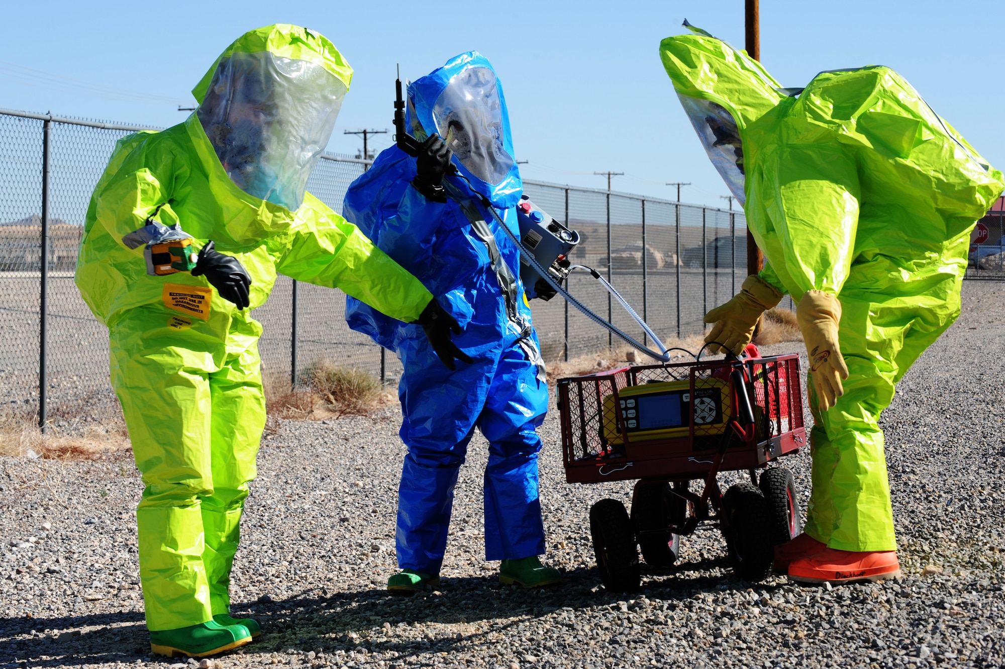 Senior Airman Nicholas Johnson and Staff Sgt. Lewis Carter, 99th Medical Group, bioenvironmental engineers and Airman 1st Class Matthew Ohara, 99th Civil Engineer emergency management journeyman, apply the lessons they learned during Integrated Response Training Feb. 28, 2013 at Nellis Air Force Base, Nev. Integrated Base Response Training is a five day-long workshop that provides emergency responders with an opportunity to employ Homeland Defense and expeditionary detection equipment in realistic scenarios. (U.S. Air Force photo by Staff Sgt. William P. Coleman)
  

