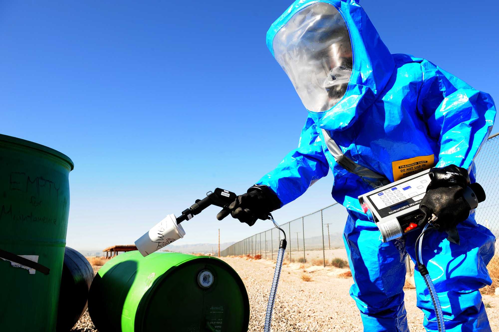 Staff Sgt. Lewis Carter, 99th Medical Group bioenvironmental engineer craftsman, uses a TVA1000B Toxic Vapor Analyzer to quantify the amount of harmful vapors in the air during a simulated chemical spill Feb. 28, 2013 at Nellis Air Force Base, Nev. In this scenario, Carter had to measure and record the amount of hydrogen sulfide gas created from a semi-truck colliding with a train. (U.S. Air Force photo by Staff Sgt. William P. Coleman)
  

