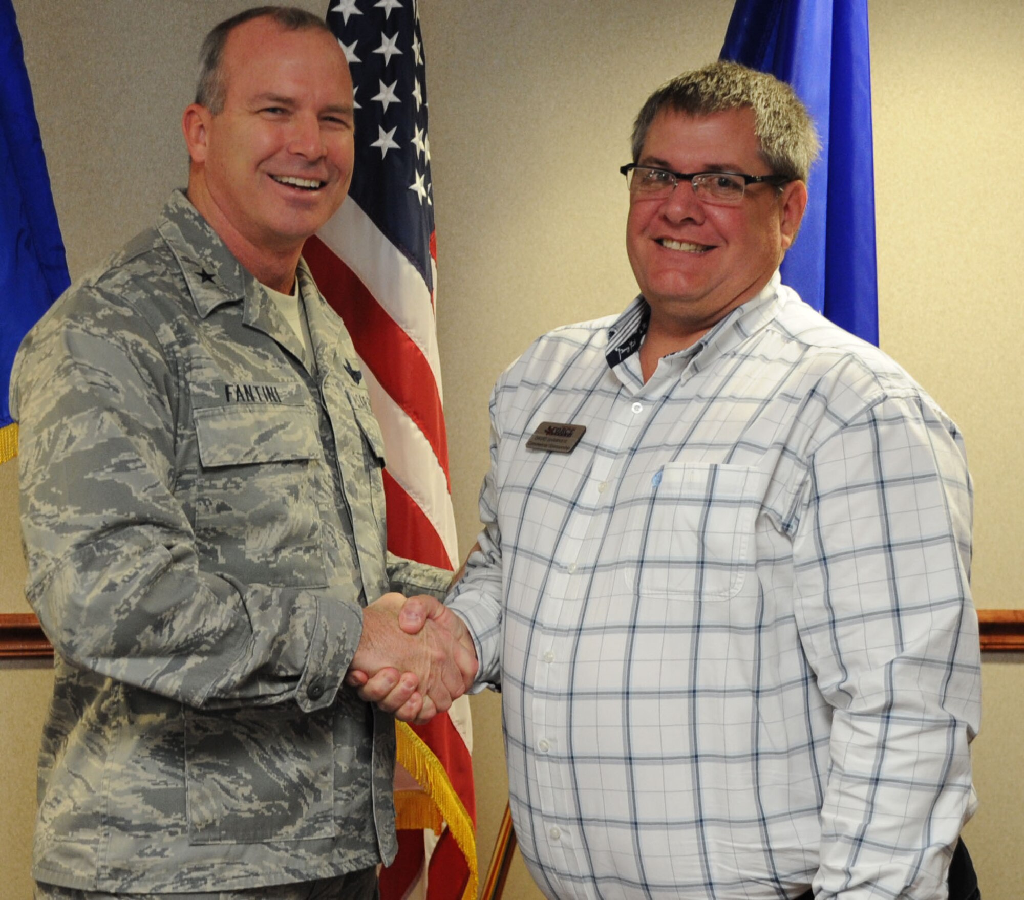 Brig. Gen. Michael Fantini, commander of the 82nd Training Wing, congratulates the wingman of choice, David Shawver of the 82nd Force Support Squadron in the wing conference room March 6, 2013.  (U.S. Air Force photo by Airman First Class Jelani Gibson)