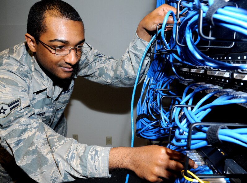 Airman 1st Class Rafeal Beckwith, a client systems technician with the 71st Communications Squadron, inspects the switchboard in Building 246 at Vance Air Force Base, Okla. Beckwith was named the 71st Flying Training Wing Airman of the Month for February. (U.S. Air Force photo/ Airman 1st Class Frank Casciotta)
