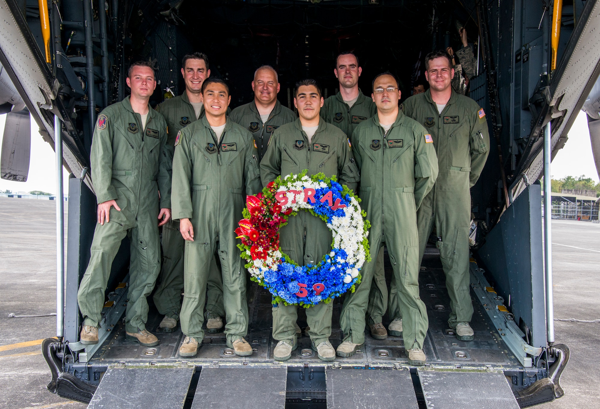 Members of the 1st Special Operations Squadron pose with a wreath that will be dropped from a U.S. Air Force  MC-130H Combat Talon II special operations aircraft to memorialize Stray 59 on Feb 26, 2013. Stray 59 was a 1st Special Operations Squadron U.S. Air Force MC-130E Combat Talon I special operations aircraft that went down in 1981 over Subic Bay, Philippines, during a training mission. (U. S. Air Force photo/Tech. Sgt. Kristine Dreyer)