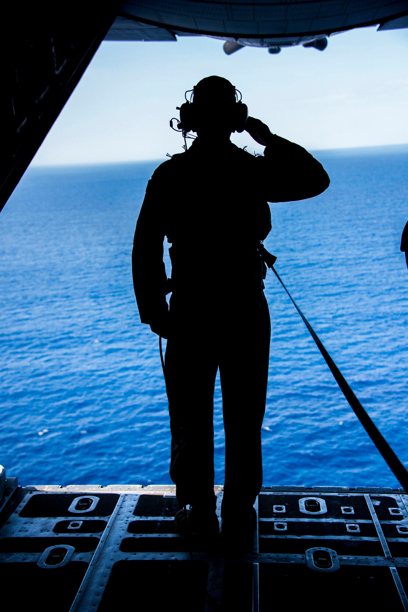 U.S. Air Force Senior Airman Dan Stearns, 1st Special Operations Squadron Loadmaster, salutes the crash site of Stray 59 over Subic Bay, Philippines, Feb 26, 2013. Stray 59 was a 1st Special Operations Squadron U.S. Air Force MC-130E Combat Talon I special operations aircraft that went down in 1981 over Subic Bay, Philippines, during a training mission. (U. S. Air Force photo/Tech. Sgt. Kristine Dreyer)