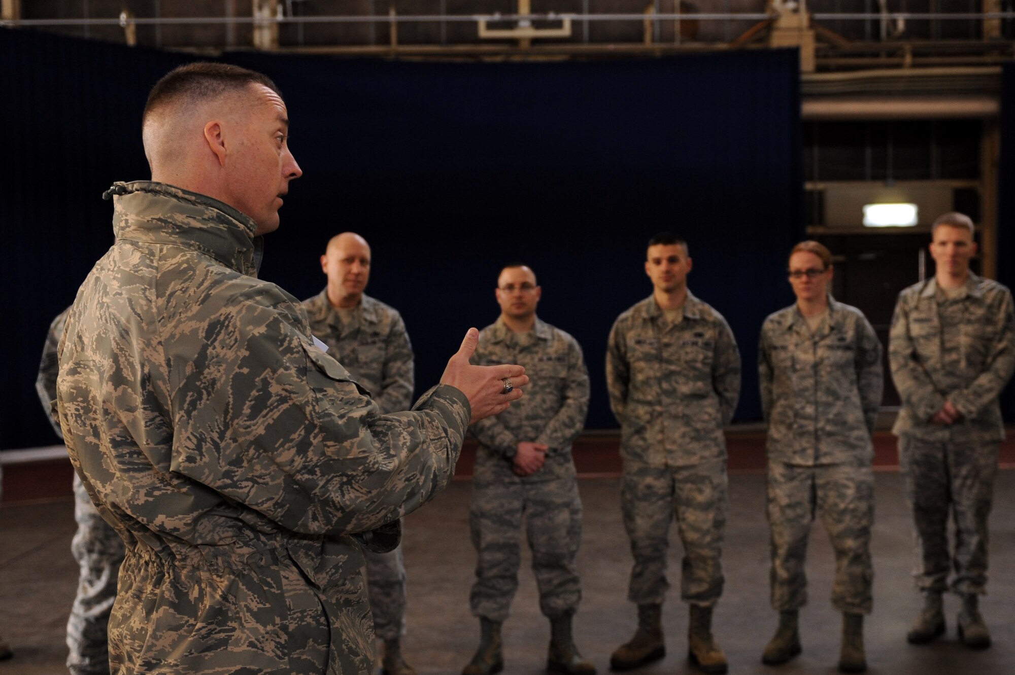 U.S. Air Force Chief Master Sgt. Douglas McIntyre, U.S. Forces, Japan, and 5th Air Force command chief, speaks to Airmen from the 35th Logistics Readiness Squadron during a base visit at Misawa Air Base, Japan, March 5, 2013. McIntyre accompanied U.S. Navy Command Master Chief Mark Rudes, U.S. Pacific Command senior enlisted leader, on a base tour where they visited facilities and talked to Airmen, Sailors and Soldiers. (U.S. Air Force photo by Airman 1st Class Kia Atkins)