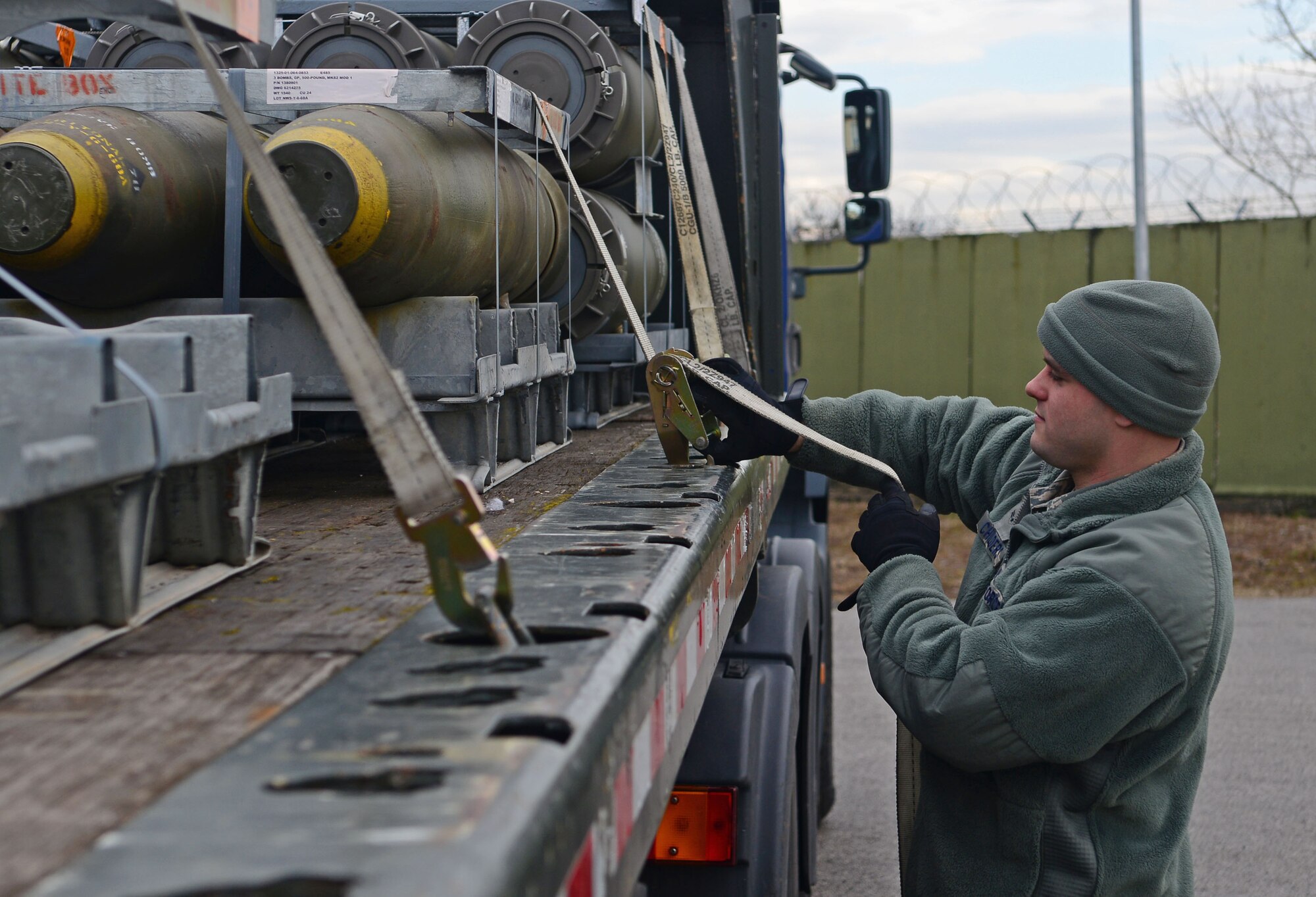 Airman 1st Class Justin Childers, 31st Munitions Squadron storage crew member, untightens a strap to a stack of BLU-129 bombs, Feb. 27, 2013 at Aviano Air Base, Italy. Under the 31st MUNS, there are six different flights that provide armament, production, materiel, weapons, systems and programs for the 510th and 555th Fighter squadrons and the 31st Security Forces Squadron. (U.S. Air Force photo/Airman 1st Class Matthew Lotz)