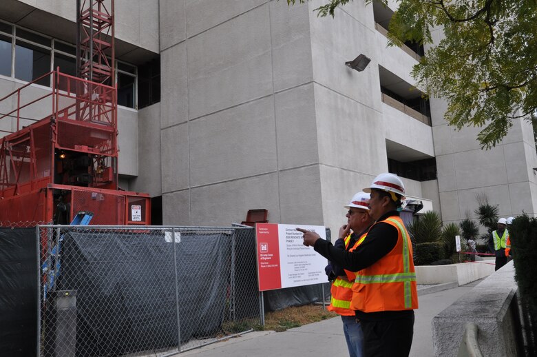 Steve McCombs, an occupational safety and health specialist with the Corps of Engineers’ Los Angeles District, observes construction at the renovation site of the Greater Los Angeles VA hospital with Adorable Javier, an engineering technician also working on the project.