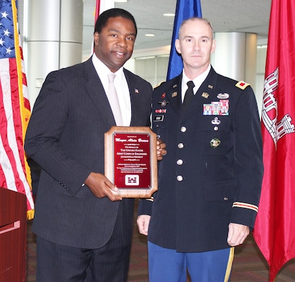 Col. Alan Dodd (right), district commander, presented a plaque to Jacksonville Mayor Alvin Brown to thank him for his participation in the Black History Month closing ceremony Feb. 27. Brown is the first African American mayor of Jacksonville, and has made military affairs a priority for his administration. 
