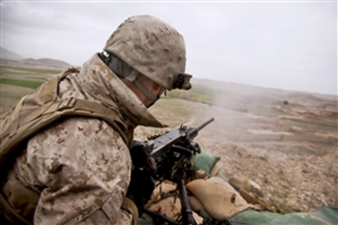 U.S. Marine Corps Lance Cpl. Kody King engages enemy positions with an M2HB .50-caliber machine gun during Operation Bullseye in Kajaki in Afghanistan's Helmand province, Feb. 27, 2013. King, a machine gunner, is assigned to the 2nd Battalion, 7th Marine Regiment, Regimental Combat Team 7.