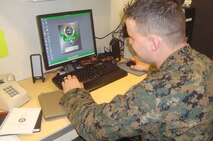 Cpl. Josten K. Mobley, a Hildebran, N.C., native and a customer service clerk, is testing the new Navy routing system aboard the USNS Robert E. Peary. A detachment of four Marines with 2nd Supply Battalion, 2nd Marine Logistics Group replenished the 26th Marine Expeditionary Unit from Feb. 7 to 17, 2013. 