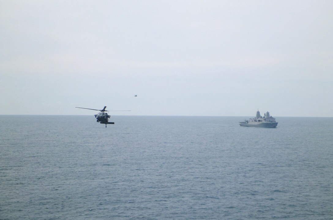 Two naval aircrafts assist with a detachment of Marines from 2nd Supply Battalion, 2nd Marine Logistics Group to replenish the 26th Marine Expeditionary Unit. The detachment of four Marines aboard the USNS Robert E. Peary utilized a new supply system through the Navy from Feb. 7 to 17, 2013. 
