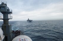 A detachment of Marines from 2nd Supply Battalion, 2nd Marine Logistics Group replenished the 26th Marine Expeditionary Unit during a deployment from Feb. 7 to 17, 2013. As the ship navigated alongside the USNS Robert E. Peary, four Marines aboard the Peary awaited to resupply the vessel.  