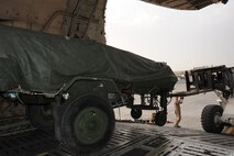 Staff Sgt. Matthew Dolan, a loadmaster assigned to Travis Air Force Base unloads an AN/TPS-59 from a C-5 Galaxy at an undisclosed base in Southwest Asia Feb. 28, 2013. The AN/TPS-59 is dual-purpose long range radar deployed to the region in support of U.S. Air Forces Central Command’s Integrated Air Defense and Missile shield. The AN/TPS-59 is one of the U.S. military’s most powerful radars and the systems inherit mobility allows for rapid worldwide deployment. The radar will be operated by Marines from 3rd Marine Aircraft Wing, Marine Air Control Group 38, Marine Air Control Squadron 1, based in Yuma, Ariz.