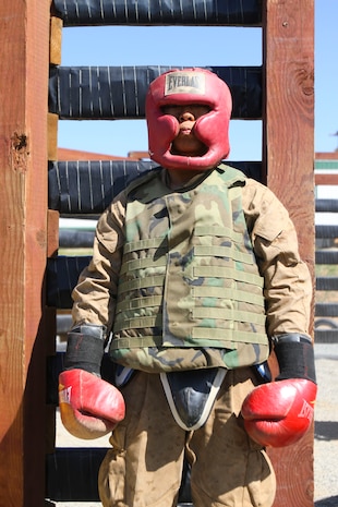 A recruit of Company K, 3rd Recruit Training Battalion, waits for his turn in the ring at Edson Range aboard Marine Corps Base Camp Pendleton, Calif. Feb. 27. Recruits wear proper sparring gear to prevent injury.