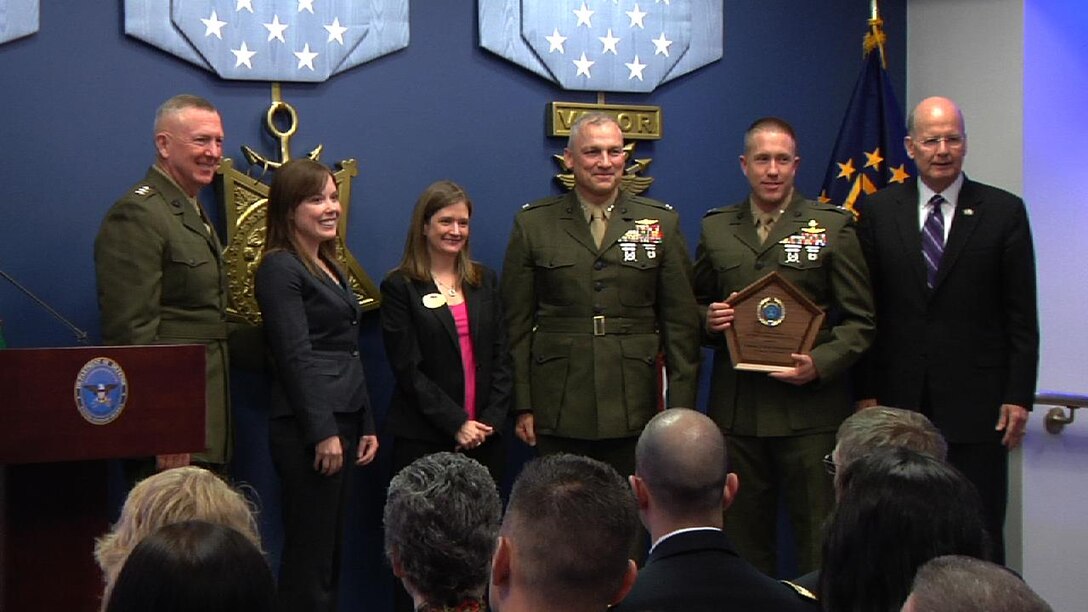 Lt. Gen. Steven A. Hummer, commander of Marine Forces Reserve and Marine Forces North, Shanon C. Neal, MARFORRES family readiness officer, Sarah Lauten, 4th Marine Division family readiness officer, Col. Christopher Starling, commanding officer of 23rd Marine Regiment, and Lt. Col. Kevin H. Hutchison, inspector-instructor for 2/23, accept the 2012 Department of Defense Reserve Family Readiness Award presented by retired Navy Vice Adm. Norb R.Ryan Jr., the president of Military Officers Association of America, at the Pentagon, March 1. 