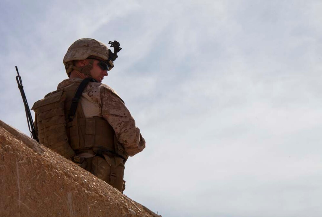U.S. Marine Corps 2nd Lt. William Wilder with Echo company, 2nd Battalion 9th Marines, Regimental Combat Team 7 (RCT) 7, observes his Marines patrol through a mock Afghan village during a training exercise on Camp Bastion, Helmand province, Afghanistan, March 3, 2013. The Marines and Sailors of Echo company conducted the training in preparation for an upcoming combat operation in support of Operation Enduring Freedom. (U.S. Marine Corps photo by Staff Sgt. Ezekiel R. Kitandwe/Released)
