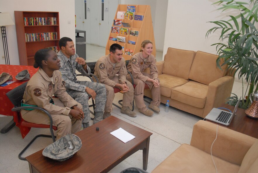 Members of the 816th Expeditionary Airlift Squadron deployed to Southwest Asia use teleconferencing to speak with Air Force Junior Reserve Officer Training Corps NC-955 Cadet Airmen from Piedmont High School in Monroe, N.C. Feb. 25. C-17 pilot 1st Lt. Anne Marie Kemp, loadmaster Airman 1st Class Vincenzo Denisi and intelligence analyst Airman 1st Class Omari Briggs, deployed from 437th Airlift Wing, Charleston Air Force Base, S.C., and flying crew chief Tech. Sgt. Tara Jackson, deployed from the 62nd Aircraft Maintenance Squadron, Joint Base Lewis-McChord, Wash. volunteered their time to answer the cadet's questions about life in the Air Force, their experiences while deployed and their individual careers. (U.S. Air Force photo/Master Sgt. Christian Michael)