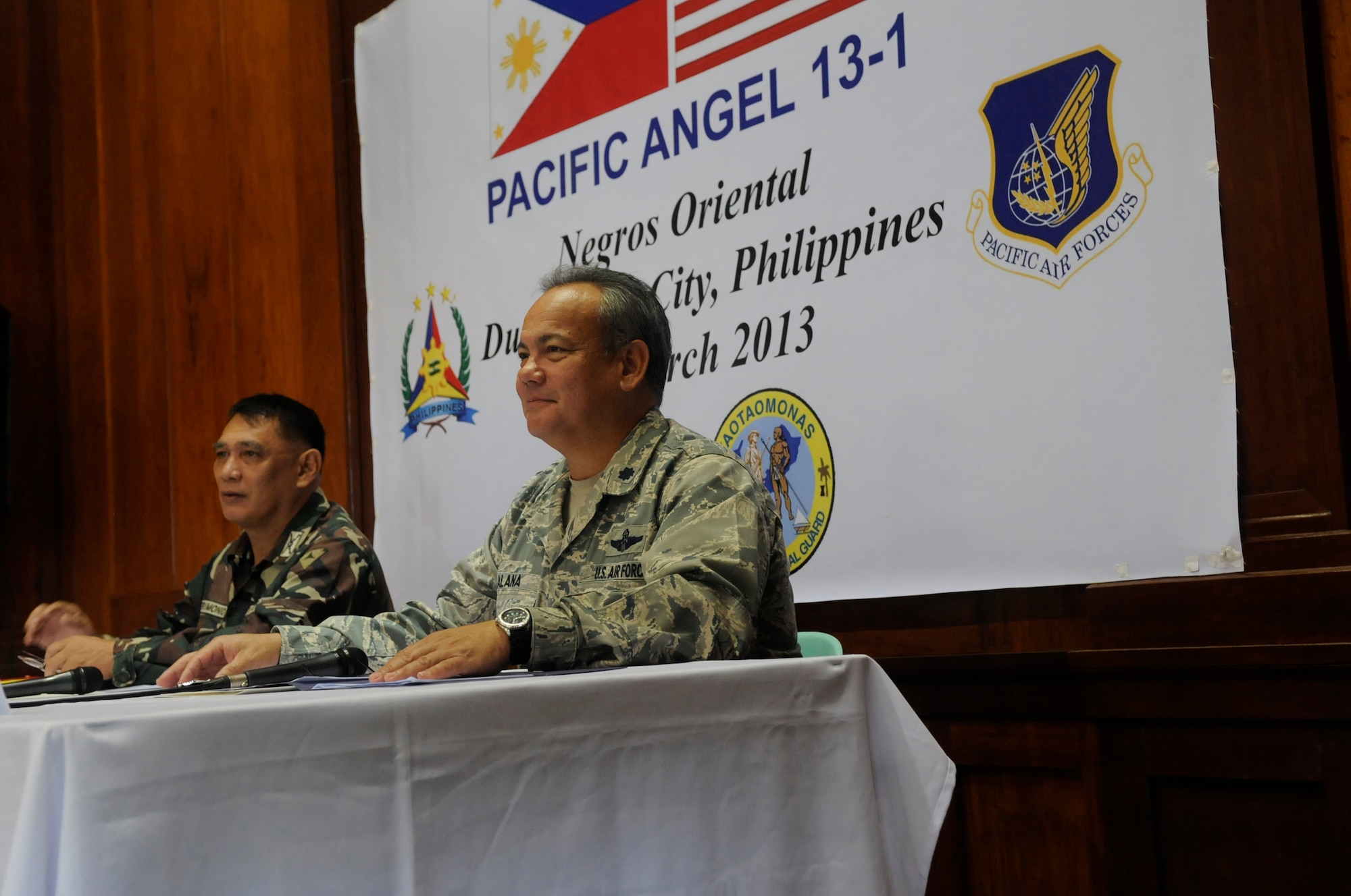 U.S. Air Force Lt. Col. Alvin Alana and his counterpart from the Armed Forces of the Philippines, Col. Francisco Patrimonio, conduct a press conference at the beginning of Operation Pacific Angel-Philippines in Dumaguete March 4, 2013. Alana is the mission commander from the Hawaii Air National Guard.   Operation PACANGEL is a joint and combined humanitarian assistance exercise held in various countries several times a year and includes medical, dental, optometry, engineering programs and various subject-matter expert exchanges. (U.S. Air Force photo/Senior Master Sgt. J.C. Woodring) 