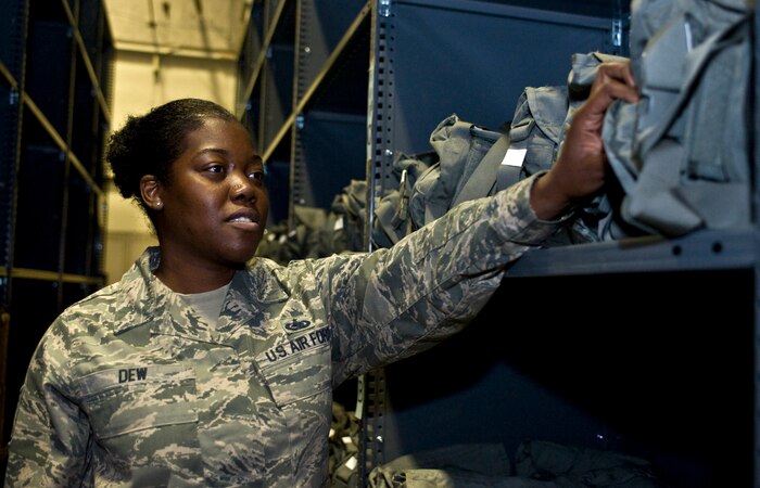 Tech. Sgt. Jovanda Dew, 99th Logistics Readiness Squadron assistant NCO in charge of individual protective equipment, conducts an inventory Mar.7, 2013, at Nellis Air Force Base, Nev. Originally from Chicago, Ill., Dew has served 5 years in the Air Force and is in charge of managing the 99th LRS supply warehouse. (U.S. Air Force photo by Senior Airman Matthew Lancaster)