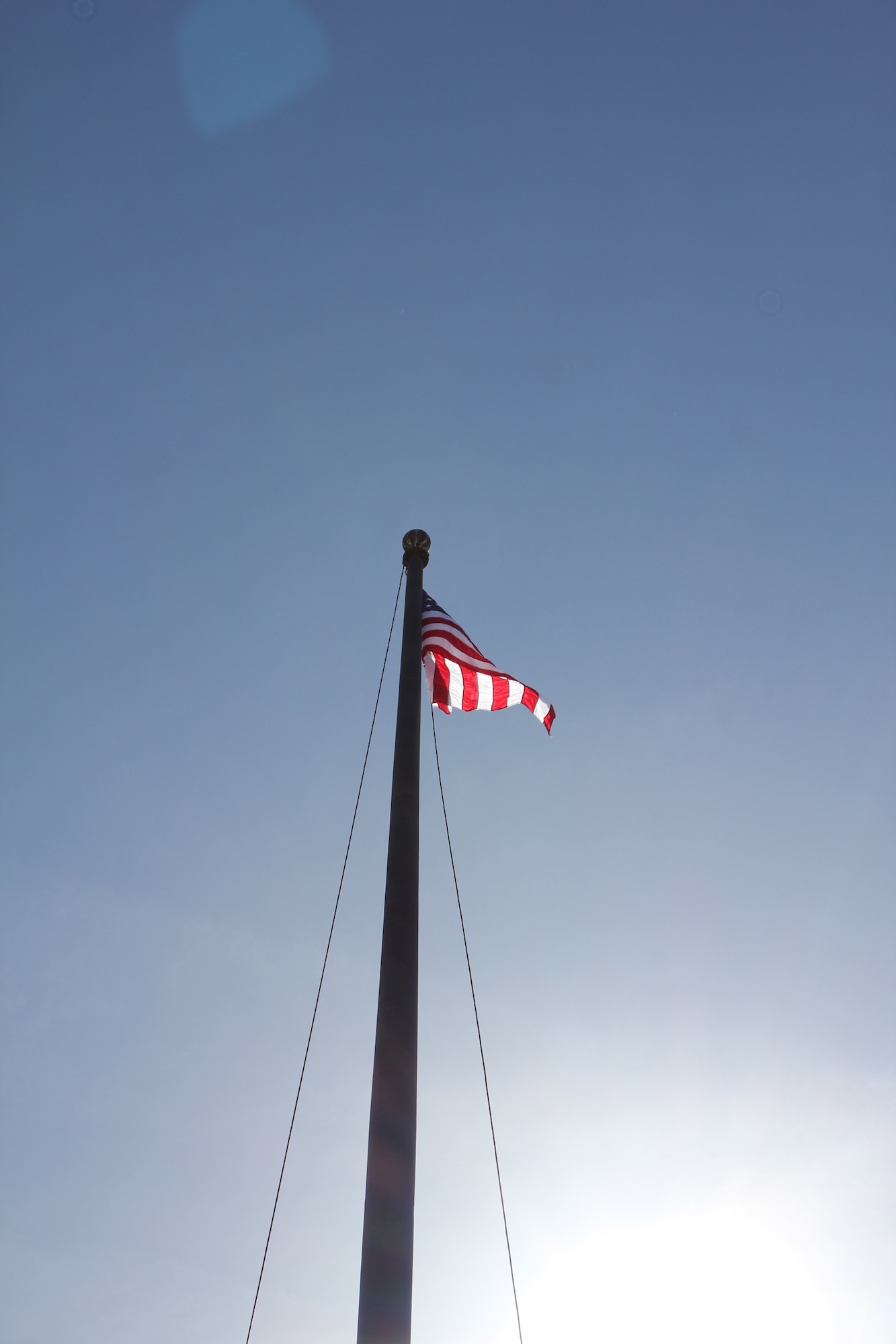 A U.S. flag flew over the former ARPC building in Denver today. The flag ceremony honored the retirement of the center's 29th commander, Maj. Gen. Eric Crabtree. (U.S. Air Force photo/Cindy Dewey)