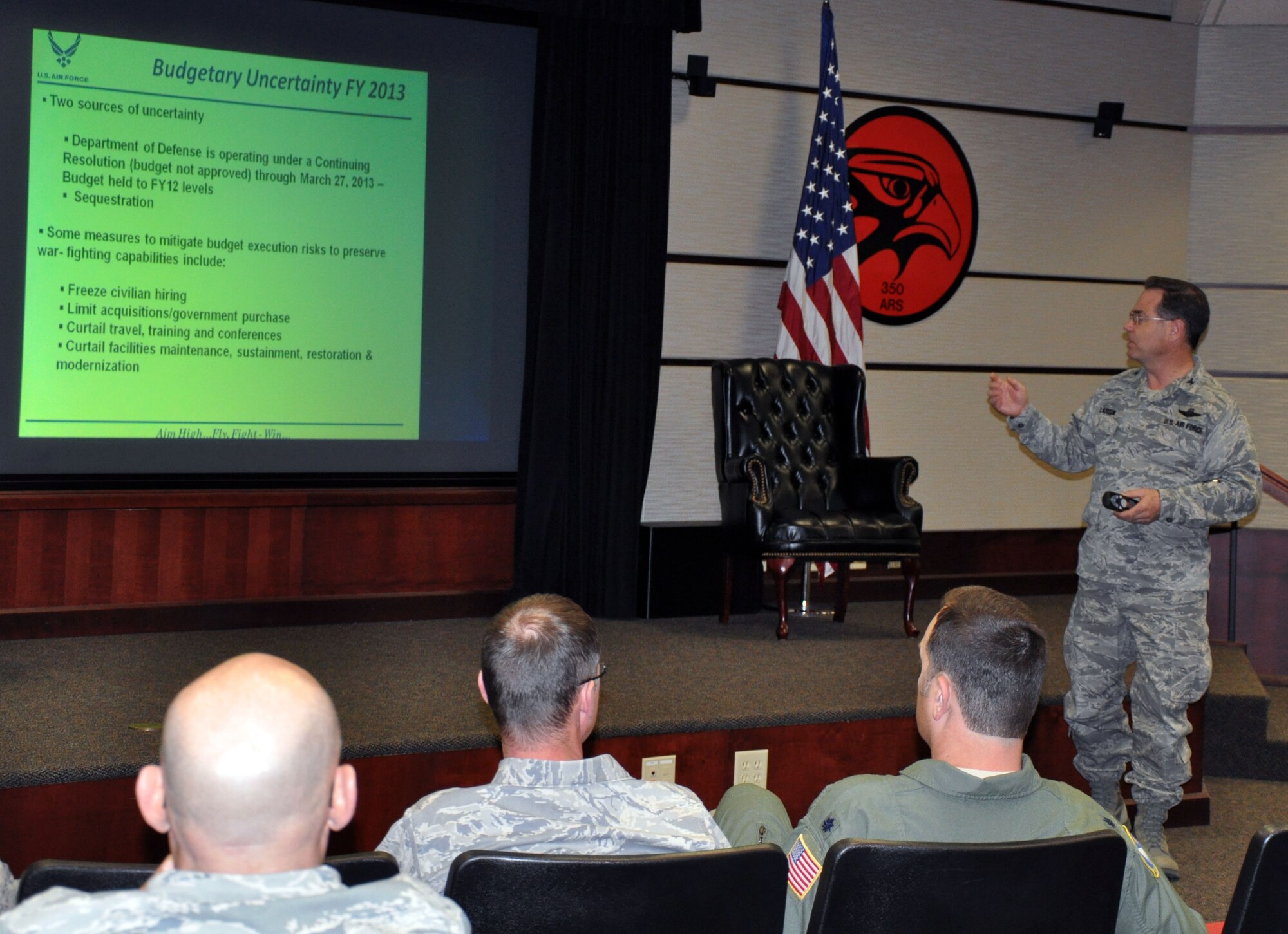 Col. Mark S. Larson, commander of the Air Force Reserve 931st Air Refueling Group, speaks to all civilian employees of the group during a civilian commander's call at McConnell Air Force Base, Kan., March 7, 2013.  Larson spoke to the employees about the sequestration and resulting furloughs for Department of Defense civilian employees.  The furloughs are currently scheduled to begin in late April.  (U.S. Air Force photo by 1st Lt. Zach Anderson)