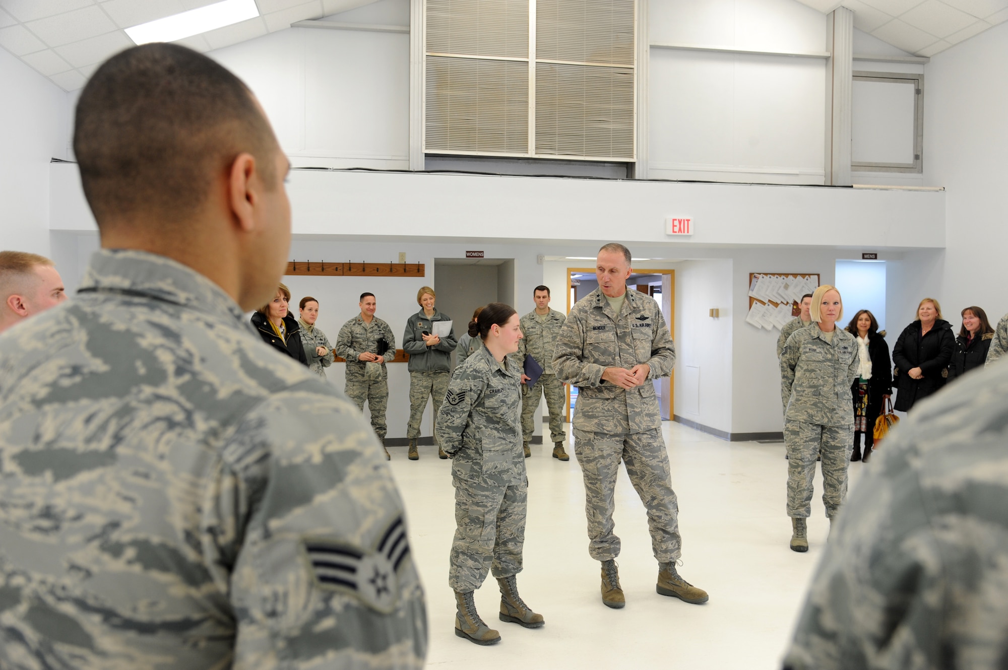(At center) Staff Sgt. Alexandra Crawley, Grand Forks Air Force Base Honor Guard NCO in charge, is asked to step forward by Maj. Gen. William Bender, during the U.S. Air Force Expeditionary Center commander’s visit to the North Dakota base on Feb. 22, 2013. Bender surprised Crawley with some good news, but not before raising the NCO’s level of curiosity by skipping her while he coined other Base Honor Guard Airmen. (U.S. Air Force photo/Airman 1st Class Xavier Navarro)
