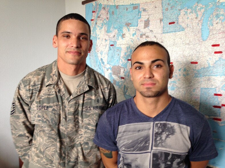 Tech. Sgt. Joshua Lopez stands with his brother trainee Christian Lopez at the recruiting office here at MacDill Air Force Base, Fla. The brothers will both be assigned to the 927th Air Refueling Wing (Air Force photo by Maj. Shane Huff)