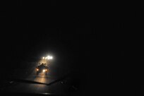 Military vehicles convoy Security Forces Airmen during a night-training mission. The Airmen spent 26 days in February attending the Combat Leadership Course, Level II, at Joint Base San Antonio-Camp Bullis, Texas. A total of 42 Security Forces Airmen spent the six weeks learning Security Forces operations and practical field skills such as moving as teams and squads, as well as conducting missions in the field. The course is taught several times during the year through the Security Forces Academy, part of the 343rd Training Squadron at JBSA-Lackland. (U.S. Air Force photo by Senior Airman Matthew Fredericks/Released)