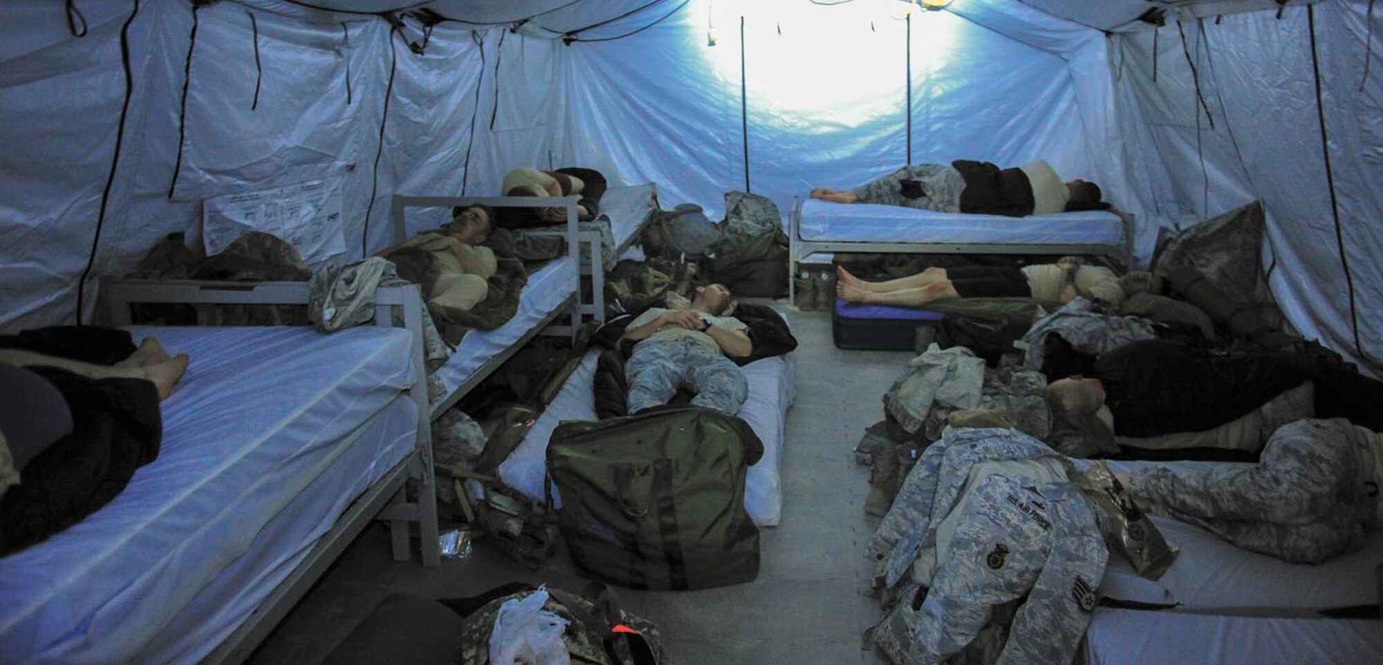 Security forces Airmen sleep after finishing a training mission. These Airmen spent 26 days in February attending the Combat Leadership Course, Level II, at Joint Base San Antonio-Camp Bullis, Texas. A total of 42 Security Forces Airmen spent the six weeks learning Security Forces operations and practical field skills such as moving as teams and squads, as well as conducting missions in the field. The course is taught several times during the year through the Security Forces Academy, part of the 343rd Training Squadron at JBSA-Lackland. (U.S. Air Force photo by Airman 1st Class Colville McFee/Released)