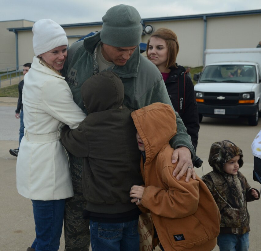 Airmen of the 136th Airlift Wing and their families bid farewell to each other prior to departing for Southwest Asia at NAS Fort Worth JRB, Texas, Feb. 26, 2013. The Airmen will support the Air Expeditionary Forces in Southwest Asia from 60 to 180 days. (National Guard photos by Senior Master Sgt. Elizabeth Gilbert)