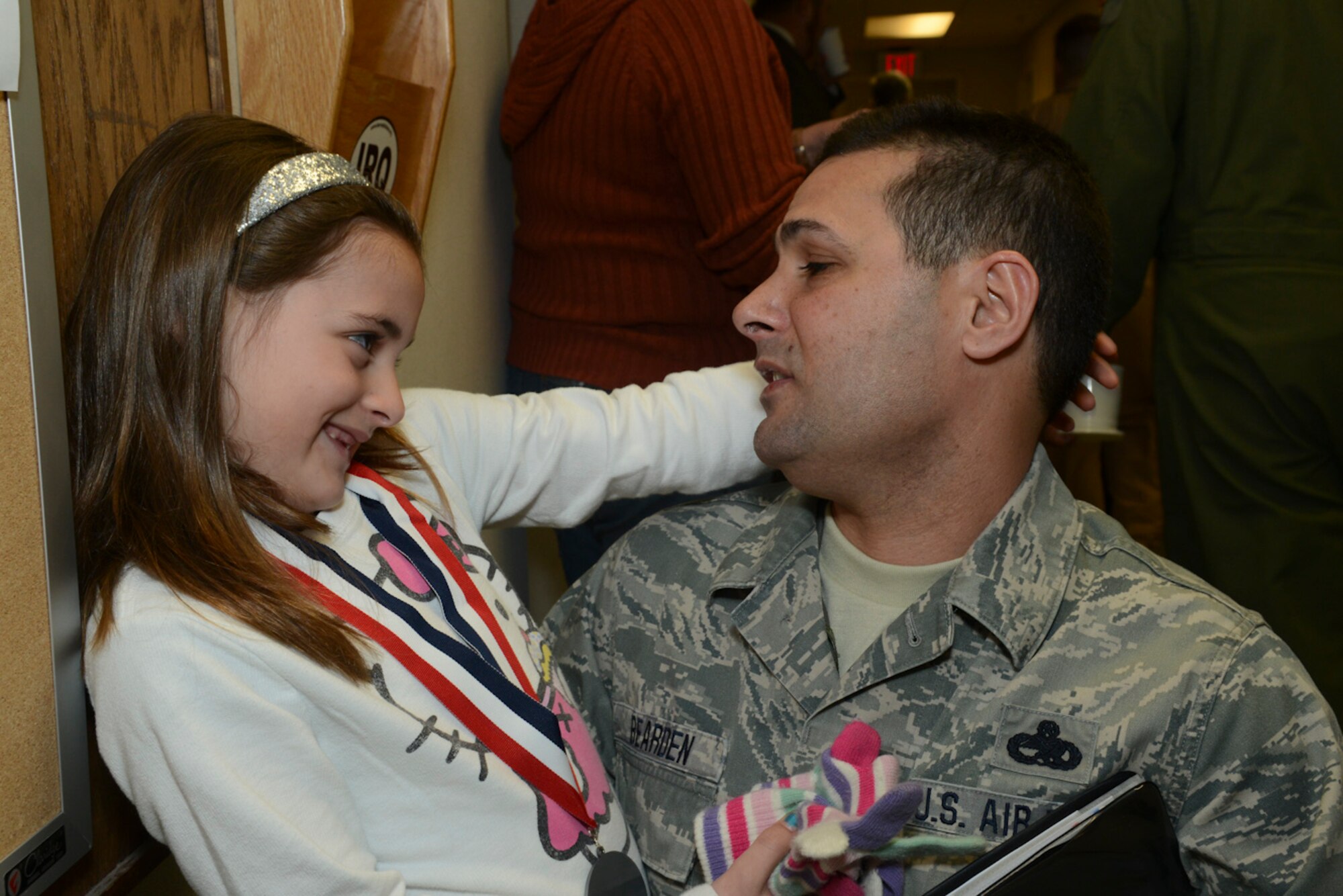 Senior Master Sgt. Shawn Bearden, First Sgt., 136th Airlift Wing and his daughter spend quality time together prior to his departure for Southwest Asia at NAS Fort Worth JRB, Texas, Feb. 26, 2013. The Airmen will support the Air Expeditionary Forces in Southwest Asia from 60 to 180 days. (National Guard photos by Senior Master Sgt. Elizabeth Gilbert)