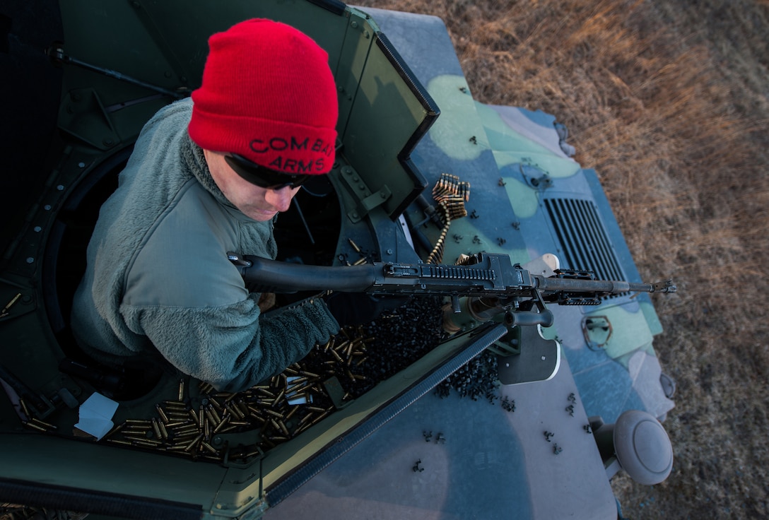 Staff Sgt. Sean Hornaday, 11th Security Forces Group Combat Arms Training and Maintenance instructor fires an M240B on top of a HMMWV during heavy weapons qualification Mar. 4, 2013, at Marine Corps Base Quantico firing range, Quantico, Va. SF Airmen qualify in heavy weapons as part of pre-deployment training. (U.S. Air Force photo by Staff Sgt. Perry Aston)