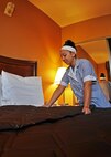 Ruthann Karr, a housekeeper at the Duke Inn and Visiting Quarters, makes a bed prior to the grand-reopening of one of Duke Field’s newest fully renovated lodging facilities March 1, 2013. The renovations corrected decades of substandard lodging for the facilities originally built in the 1950s. (U.S. Air Force photo/Dan Neely)