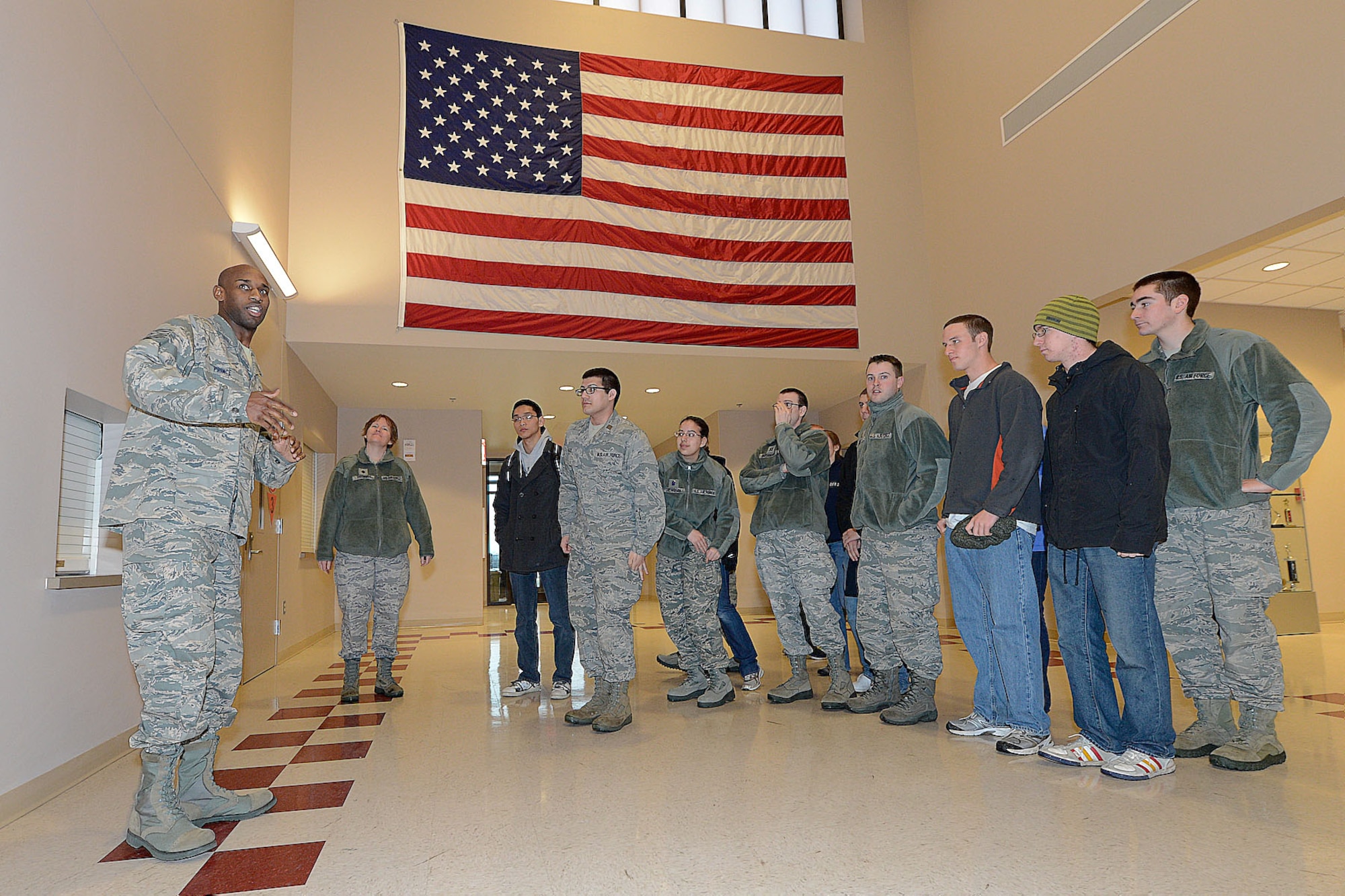 Technical Sergeant Kenyatta Prince, (left), production superintendent, Aircrew Flight Equipment section, 436th Operations Support Squadron, briefs a group of Air Force Reserve Officer Training Corps (AFROTC) cadets from Detachment 340, Worchester, Mass. on the duties, responsibilities and importance of his operation to mission success, Dover Air Force Base, Del., March 6, 2013. (U.S. Air Force photo/Greg L. Davis)
