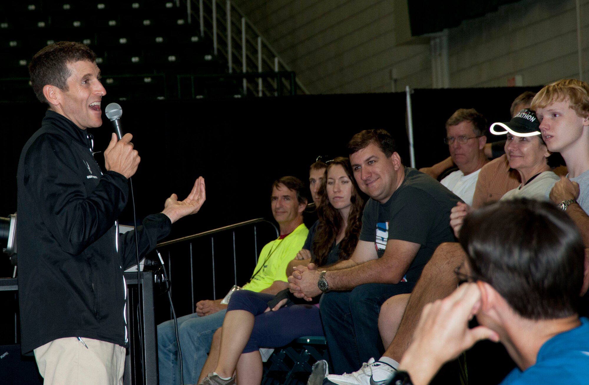 Dr. Mark Cucuzzella national expert on running healthy for life speaks to an audience about running. Dr. Cucuzzella will hold a series of free training clinics and will be a featured speaker at the 2013 Air Force Marathon Sports & Fitness Expo and Breakfast of Champions.  (U.S. Air Force Photo)