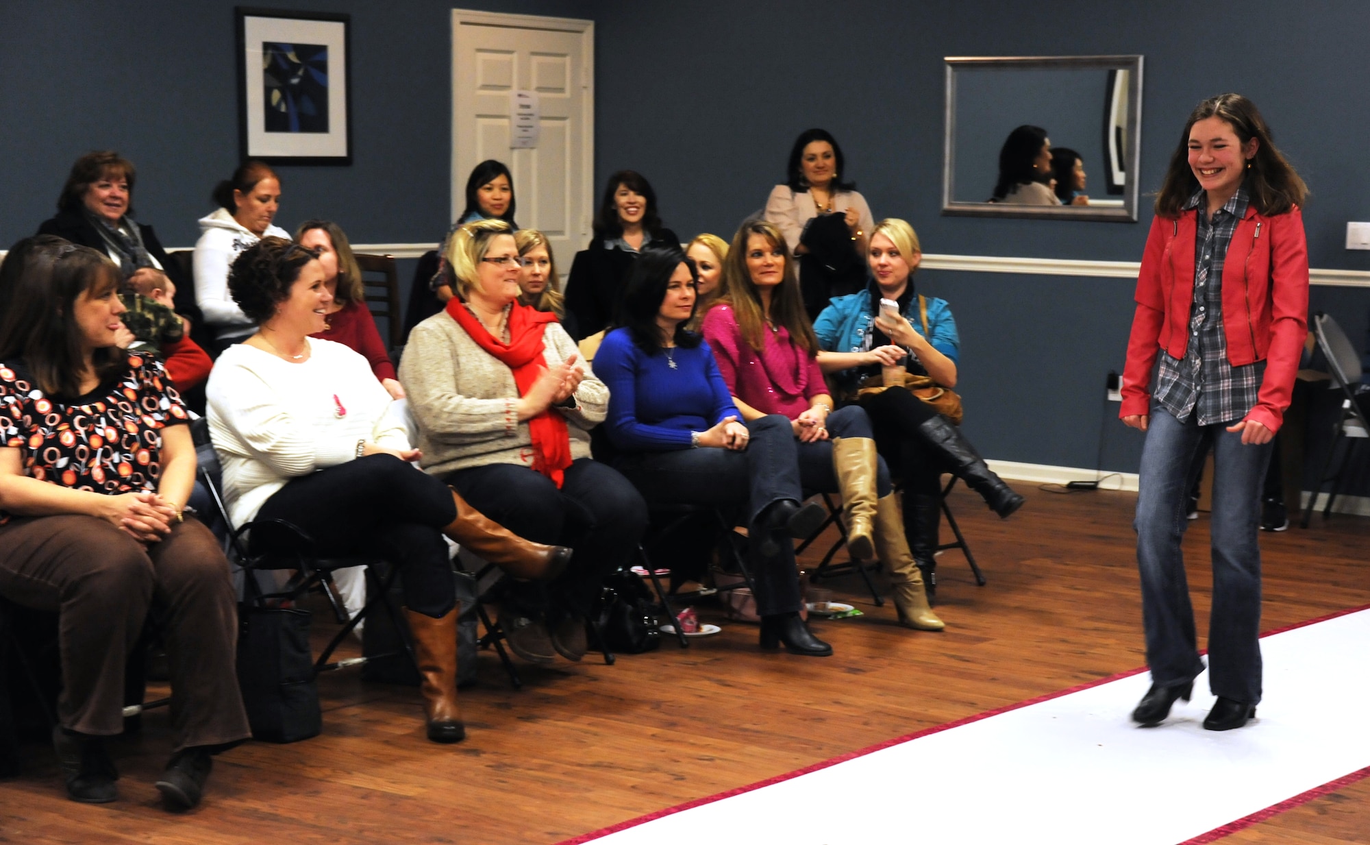 Nicole Rogers, 13, shows off a thrift store outfit during the “An Evening of Fashion” event Feb. 26, 2013, at the Saxton Community Center at Joint Base McGuire-Dix-Lakehurst, N.J. The event was organized by both the Dix Spouses’ and Civilians’ Club and the McGuire Officers’ Spouses’ Club as a way to promote joint base thrift stores. Nicole is the daughter of Army Lt. Col. James Rogers, Northeast Army Reserve Intelligence Support Center commander; and his wife Robin. 