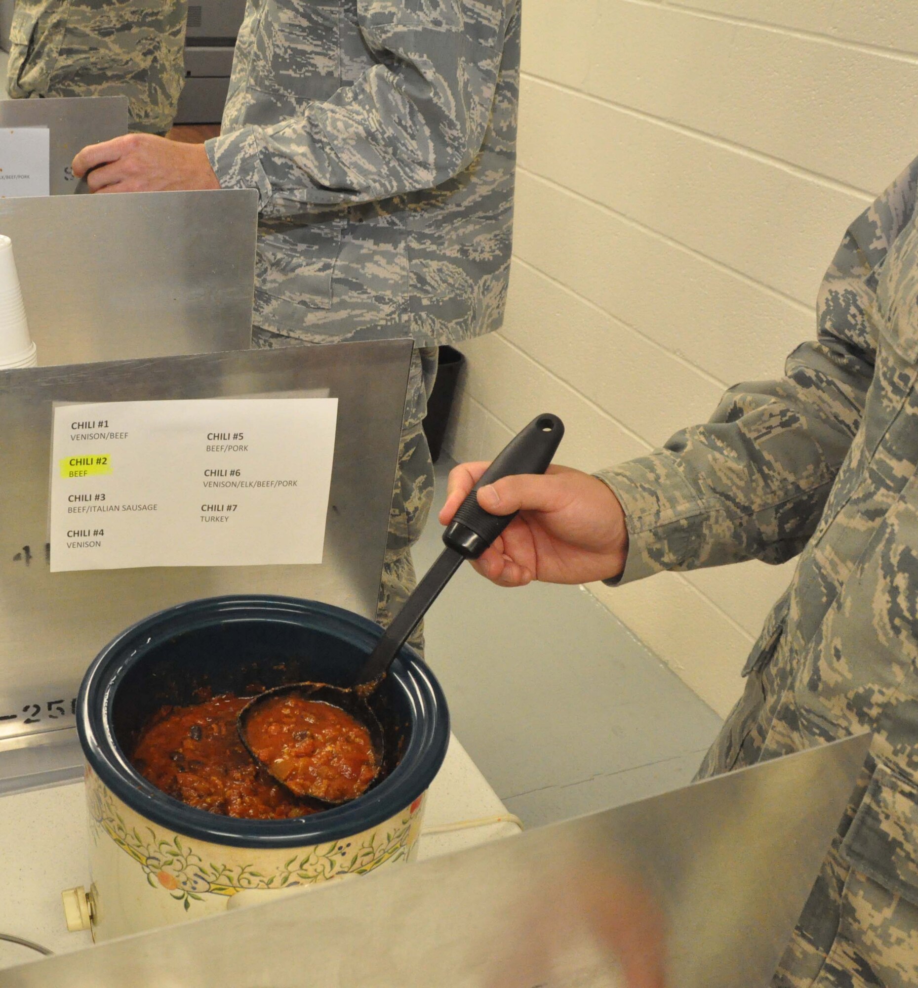 Members of the 94th Maintanence Group sampled chili in a double-blind taste test. The 94th MXG held their 2nd Annual Chili Cook-Off during the December Unit Training Assembly in maintenance bay 2. (U.S. Air Force photo/Senior Airman Christina Bozeman)