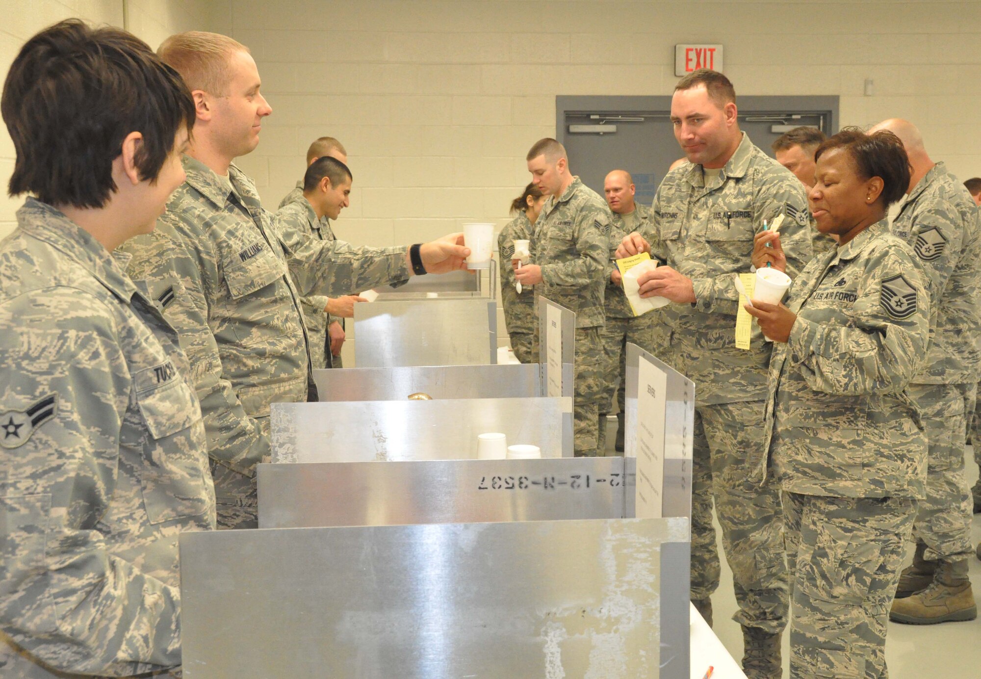 Members of the 94th Maintanence Group sampled chili in a double-blind taste test. The 94th MXG held their 2nd Annual Chili Cook-Off during the December Unit Training Assembly in maintenance bay 2. (U.S. Air Force photo/Senior Airman Christina Bozeman)