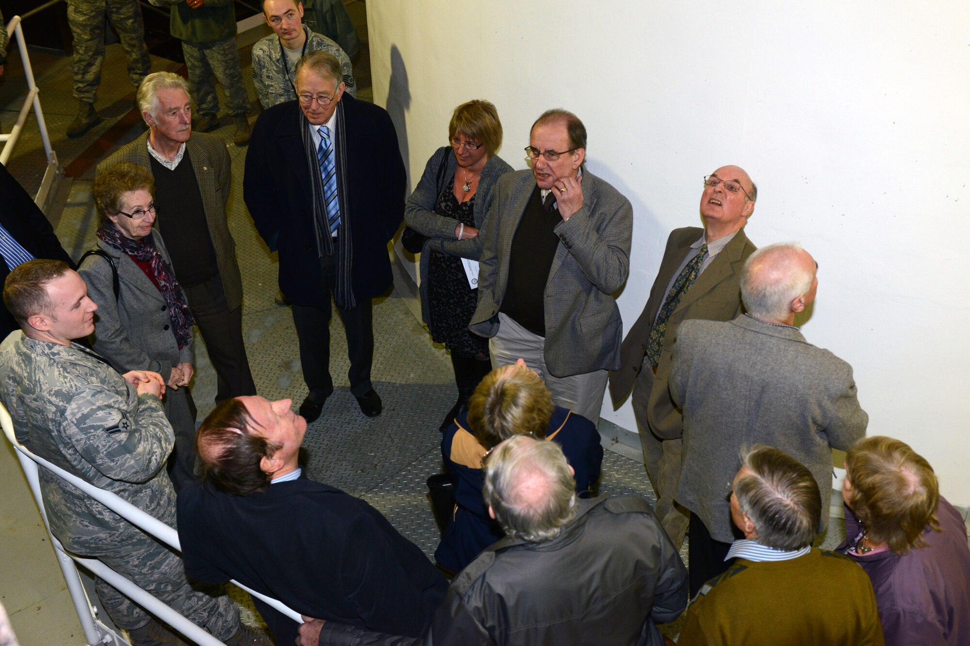 RAF CROUGHTON, United Kingdom – Airman 1st Class Jordan Heatly, 422nd Communications Squadron RF Transmission Systems, briefs members of the Aynho Conservative Club and Rotary Club of Brackley on the mission of the Satellite Communications Work center inside Building 180 (PL/1 SATCOM facility) at RAF Croughton. The groups toured the 422nd CS March 5. (U.S. Air Force photo by Tech. Sgt. Chrissy Best)