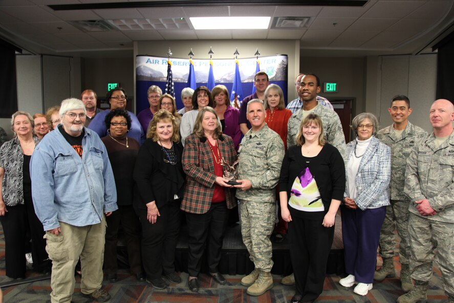 Brig. Gen. Jay Flournoy, Air Reserve Personnel Center commander, and Chief Master Sgt. Brian Wong, ARPC command chief, present the ARPC Team of the Year award to the retirements branch team. Flournoy honored ARPC’s 2012 Outstanding Performers of the Year as well as their A1 annual award winners during commander’s call March 6, 2013, on Buckley Air Force, Colo.

The team included: Debra Weule, Steve Vashon, Forest Cupples, Debra Floyd, Partricia Rosas, Lisa Vedder, Karen Jonasson, Judy Cupples, Sophia Brunt, Deborah King, Teri Eastman, Sharon Apps, Linda Higgins, Chris Fowler, John Gasbarro, John French, Edie Wallin-Sanchez, Gloria Roberts, Carol Givens, Robert Poe, Carole Packham, Sue Henderson, Tech. Sgt. Eric Grizzell, Tech. Sgt. David Bader and Senior Airman Sean Cooper. (U.S. Air Force photo/Tech. Sgt. Rob Hazelett)
