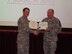 Lt. Gen. Jan-Marc Jouas, deputy commander of the United Nations Command Korea, presents the Bronze Star Medal to Chief Master Sgt. James Heishman, an individual mobilization augmentee security forces manager this month, at Osan Air Base, Republic of South Korea. Heishman deployed as the security forces manager with the Expeditionary Security Forces Squadron in Afghanistan in 2011. (Courtesy photo)