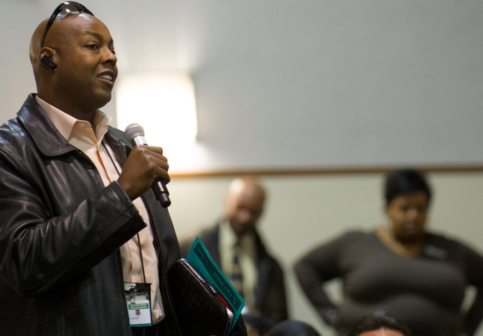 Air Force District of Washington civilian personnel ask for details about the sequestration and furlough during a town hall meeting at the base theater March 6, 2013 at Joint Base Andrews, Md. The meeting was hosted by AFDW Commander Maj. Gen. Sharon K.G. Dunbar to discuss effects of the sequestration and furlough. (U.S. Air Force photo by 1st Lt. Ashleigh Peck)