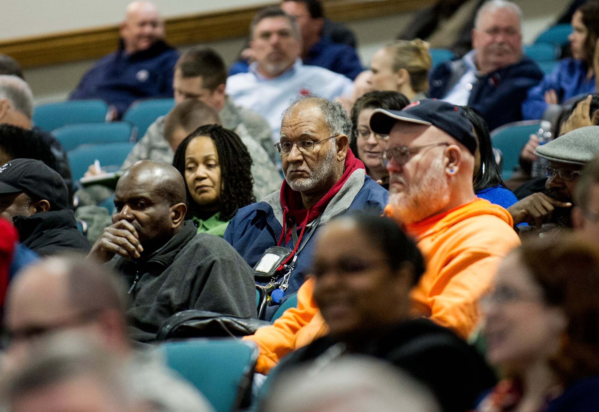 Air Force District of Washington civilian and military personnel listen for details regarding the sequestration and furlough during a town hall meeting at the base theater March 6, 2013 at Joint Base Andrews, Md. The meeting was hosted by AFDW Commander Maj. Gen. Sharon K.G. Dunbar to discuss effects of the sequestration and furlough. (U.S. Air Force photo by 1st Lt. Ashleigh Peck)