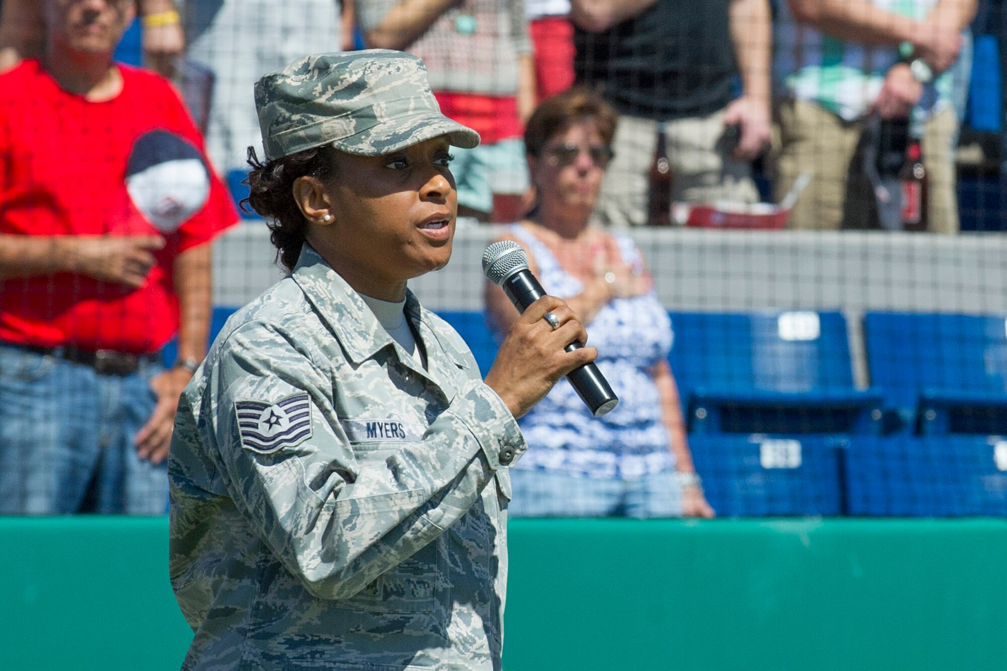 Tech. Sgt. Altrameise Myers sings the national anthem during "Military
Appreciation Day" activities held at Space Coast Stadium March 5. She is a
reservist assigned to the 920th Rescue Squadron, and a civilian employee
with the 45th Space Wing. In addition, Sgt. Myers has been selected to join
"Tops in Blue" for next season's show. (U.S. Air Force Photo/Matthew Jurgens)
