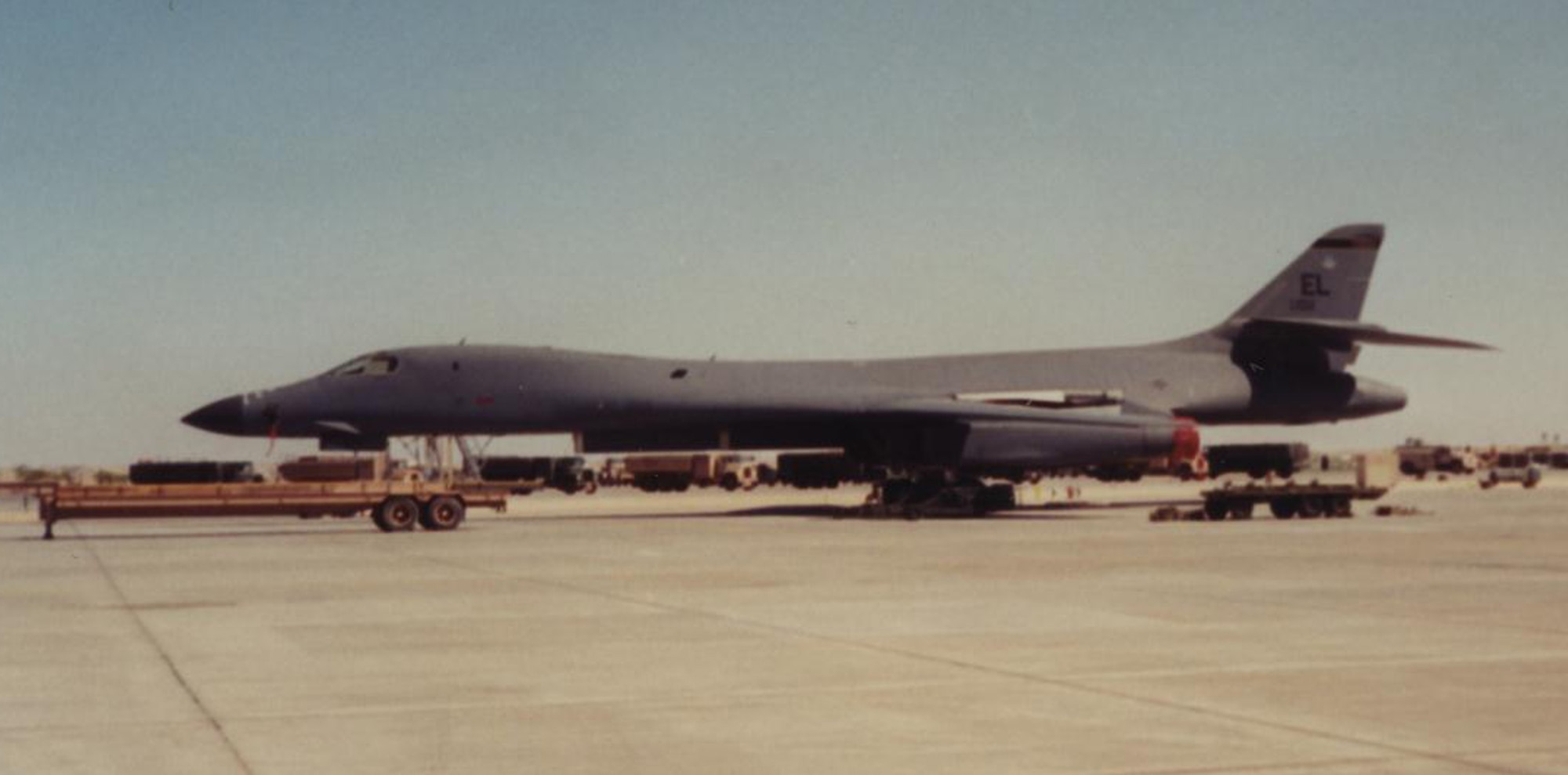 A B-1 bomber stands ready to be loaded with munitions in support of Operation Desert Fox on the flightline at Thumrait Air Base, Oman, December 1998. ODF was a four-day military campaign in response to Iraqi President Saddam Hussein's refusal to comply with United Nations weapons inspectors, and the B-1's operational combat debut. (Lt. Col. John Martin courtesy photo/Released)