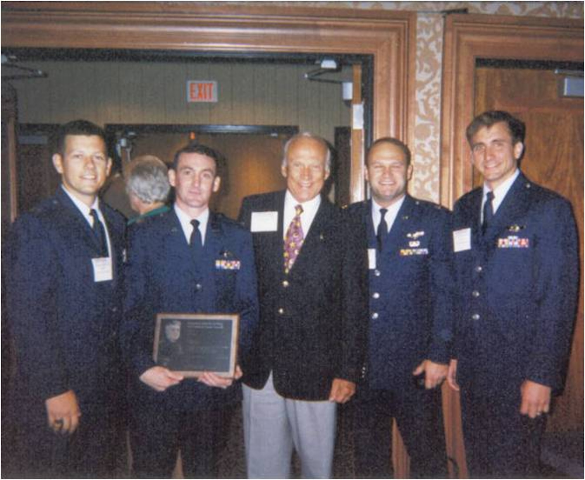 (From left to right) Capt. John Martin, Capt. Randy Kaufman, Apollo astronaut Buzz Aldrin, Capt. Joe Reidy and Capt. Jeffrey Taliaferro gather after winning the Lemay Award for their work during Operation Desert Fox at the Air Force Association banquet in Washington, D.C., September 1999. The four captains manned the B-1 bomber codenamed "Slam 4" and were recognized for being the most outstanding aircrew in the Air Force. (U.S. Air Force courtesy photo/Released)