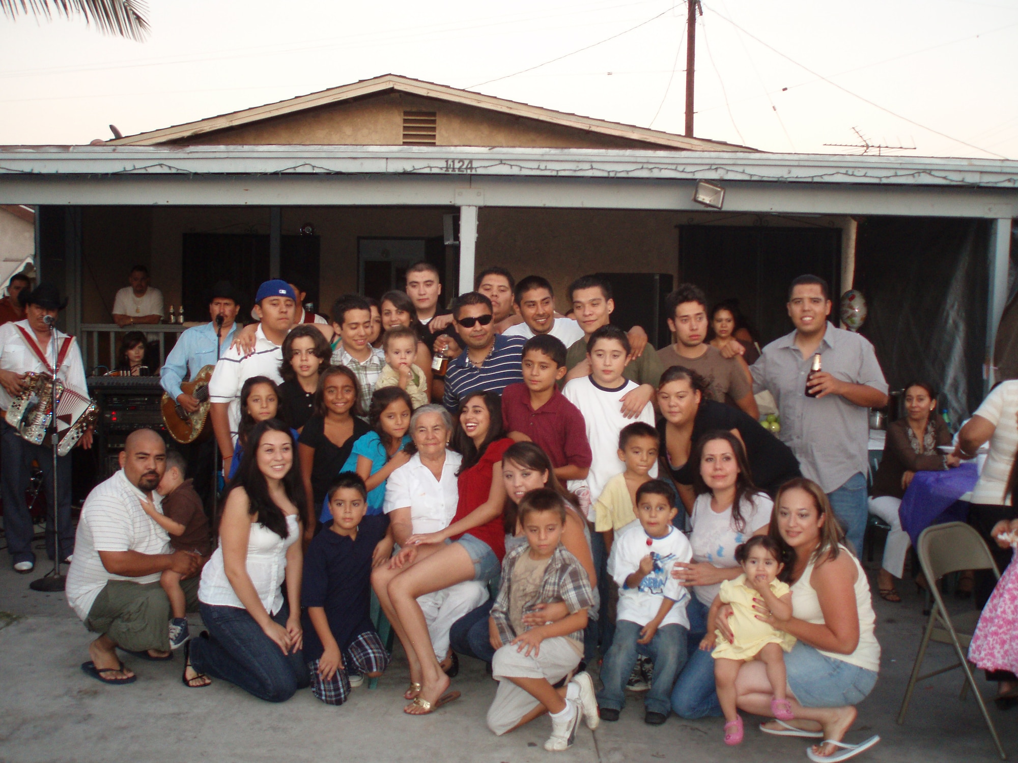 LOS ANGELES -  Senior Airman Annette Bieniek, 48th Equipment Maintenance Squadron inspection section journeyman, (second from right on the bottom row) stands with her family in Montibello, a suburb of Los Angeles.  Bieniek's story of overcoming adversity, by learning to speak English and leaving her extended family,  is one of several being featured during Womens' History Month. (Courtesy photo) 